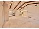 Living room with vaulted ceilings, exposed beams, and sliding doors at 3947 Country View Dr, Sarasota, FL 34233