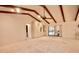 Living Room with high ceilings, exposed beams and access to pool at 3947 Country View Dr, Sarasota, FL 34233
