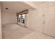 Bright living room with tiled floor and access to other rooms at 3947 Country View Dr, Sarasota, FL 34233