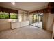 Home office with built-in shelving and access to a sunroom at 3947 Country View Dr, Sarasota, FL 34233