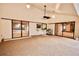 Large covered patio with access to the living room and fireplace at 3947 Country View Dr, Sarasota, FL 34233
