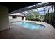 Relaxing kidney-shaped pool and screened patio area at 3947 Country View Dr, Sarasota, FL 34233