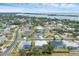 Aerial view of the neighborhood, highlighting the home's location by the water at 404 Bayside Ln, Nokomis, FL 34275