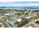 Aerial view of neighborhood with water access, showcasing home's location at 404 Bayside Ln, Nokomis, FL 34275