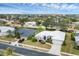 Aerial view of a house and surrounding neighborhood at 404 Bayside Ln, Nokomis, FL 34275