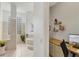 Spa-like bathroom with a soaking tub, glass shower, and home office area at 404 Bayside Ln, Nokomis, FL 34275