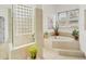 Relaxing bathroom with soaking tub, glass-enclosed shower, and window at 404 Bayside Ln, Nokomis, FL 34275