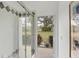 Bathroom with shower, tiled walls, and exterior access at 404 Bayside Ln, Nokomis, FL 34275