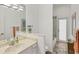 Clean bathroom with single vanity and walk-in shower at 404 Bayside Ln, Nokomis, FL 34275
