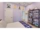 Charming bedroom with a bed, shelving, and Lord of the Rings posters at 404 Bayside Ln, Nokomis, FL 34275