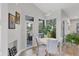 Casual dining area with round table and access to patio at 404 Bayside Ln, Nokomis, FL 34275