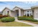Front entryway of single-story home with blue door at 404 Bayside Ln, Nokomis, FL 34275