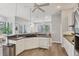 Eat-in kitchen with stainless steel appliances and breakfast bar at 404 Bayside Ln, Nokomis, FL 34275