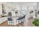 Modern kitchen with stainless steel appliances and breakfast bar at 404 Bayside Ln, Nokomis, FL 34275