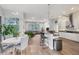 Open kitchen with island, stainless steel appliances, and breakfast bar at 404 Bayside Ln, Nokomis, FL 34275