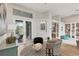 Bright living room with access to backyard and built-in shelving at 404 Bayside Ln, Nokomis, FL 34275