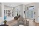 Spacious living room with built-in shelving and hardwood floors at 404 Bayside Ln, Nokomis, FL 34275