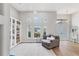 Open living space with large windows and comfortable seating at 404 Bayside Ln, Nokomis, FL 34275