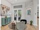 Bright living room with access to backyard and built-in shelving at 404 Bayside Ln, Nokomis, FL 34275