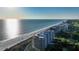 Aerial view of beachfront high-rise condos with expansive ocean views at 415 L Ambiance Dr # C204, Longboat Key, FL 34228