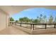 Private balcony overlooking lush tropical landscaping and trees at 415 L Ambiance Dr # C204, Longboat Key, FL 34228
