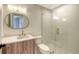 Clean bathroom with a walk-in shower and modern vanity at 415 L Ambiance Dr # C204, Longboat Key, FL 34228