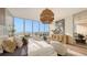 Main bedroom with ocean view, featuring a king-size bed and plush seating at 415 L Ambiance Dr # C204, Longboat Key, FL 34228