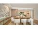 Elegant dining room features a large wooden table and comfortable seating for six at 415 L Ambiance Dr # C204, Longboat Key, FL 34228