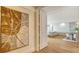 Bright and airy entryway with tasteful artwork and hardwood floors at 415 L Ambiance Dr # C204, Longboat Key, FL 34228