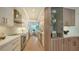Modern kitchen with white and wood cabinets and a spacious layout at 415 L Ambiance Dr # C204, Longboat Key, FL 34228
