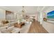 Open concept living room with sectional sofa and hardwood floors at 415 L Ambiance Dr # C204, Longboat Key, FL 34228