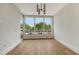 Open living room with large windows and hardwood floors at 415 L Ambiance Dr # C204, Longboat Key, FL 34228