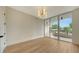 Bright living room with access to a balcony and hardwood floors at 415 L Ambiance Dr # C204, Longboat Key, FL 34228