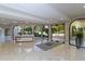 Elegant lobby with marble floors and arched windows at 415 L Ambiance Dr # C204, Longboat Key, FL 34228
