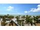 Panoramic ocean view with lush tropical foliage at 415 L Ambiance Dr # C204, Longboat Key, FL 34228