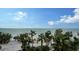 Stunning view of the ocean and white sand beach from above at 415 L Ambiance Dr # C204, Longboat Key, FL 34228