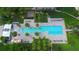 Large rectangular pool with surrounding lounge chairs at 415 L Ambiance Dr # C204, Longboat Key, FL 34228