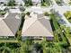 Aerial view of house, showcasing roofline and backyard landscaping at 5050 Maymont Park, Bradenton, FL 34203