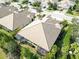 Aerial view of house and surrounding neighborhood, highlighting roof and landscaping at 5050 Maymont Park, Bradenton, FL 34203