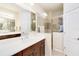 Elegant bathroom with double vanity and walk-in shower at 5050 Maymont Park, Bradenton, FL 34203