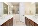 Bathroom with double vanity and walk-in shower at 5050 Maymont Park, Bradenton, FL 34203