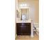 Small bathroom with single vanity and toilet at 5050 Maymont Park, Bradenton, FL 34203