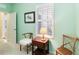 Bedroom with window, wooden chair, and table at 5050 Maymont Park, Bradenton, FL 34203