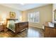 Spacious bedroom with wood flooring and large window at 5050 Maymont Park, Bradenton, FL 34203