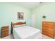 Light green walls and wood furniture bedroom at 5050 Maymont Park, Bradenton, FL 34203