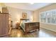 Cozy bedroom with wooden furniture and plenty of natural light at 5050 Maymont Park, Bradenton, FL 34203