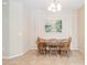 Bright dining area with wooden table and chairs, perfect for Gathering meals at 5050 Maymont Park, Bradenton, FL 34203