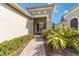 Brick walkway to home entrance with manicured hedges at 5050 Maymont Park, Bradenton, FL 34203