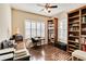 Home office with built-in bookshelves and a workspace at 5050 Maymont Park, Bradenton, FL 34203