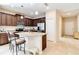 Kitchen with granite countertops, stainless steel appliances, and an island at 5050 Maymont Park, Bradenton, FL 34203